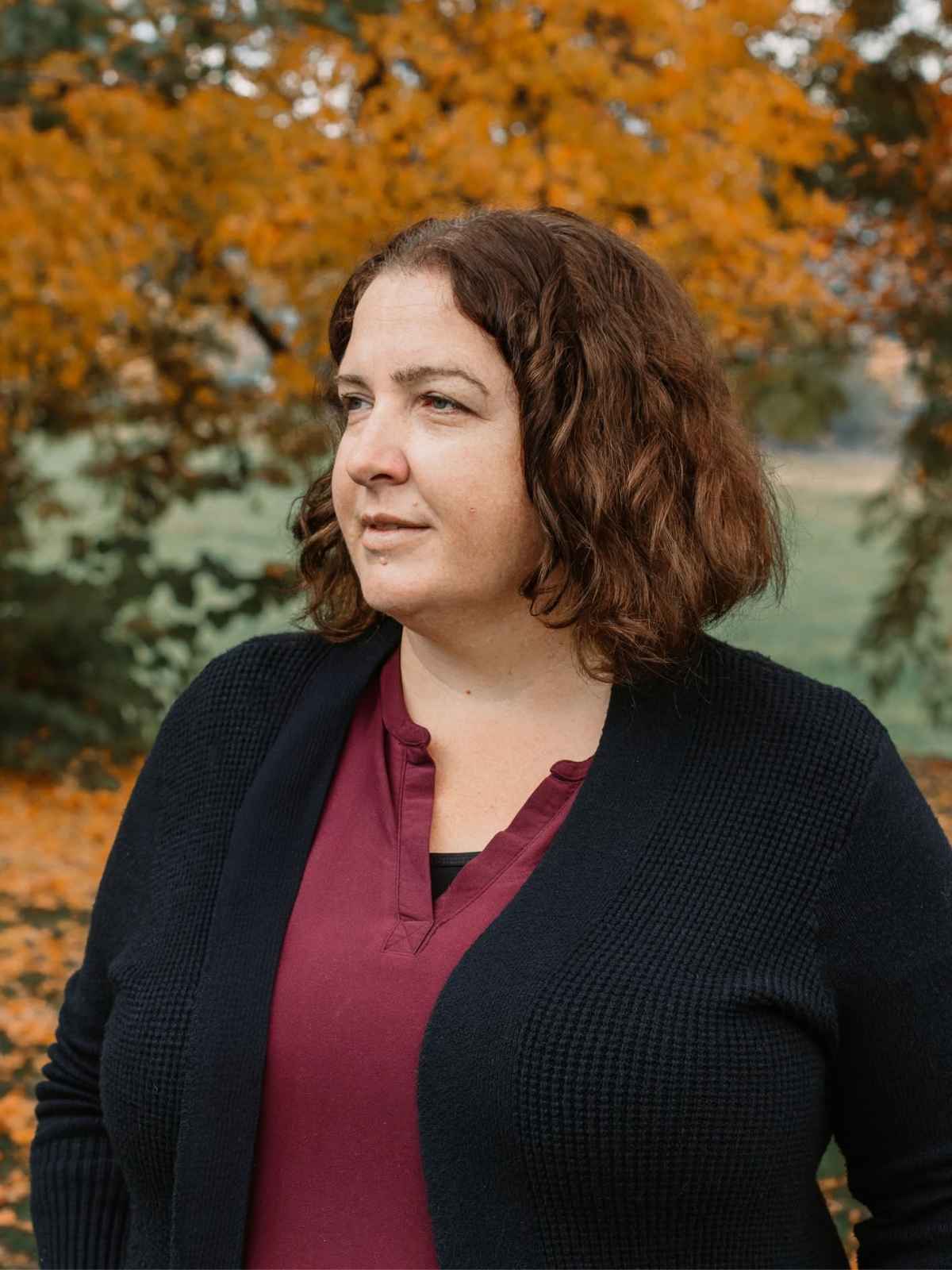 Julie Bond of Peace Mediation outdoors in autumn