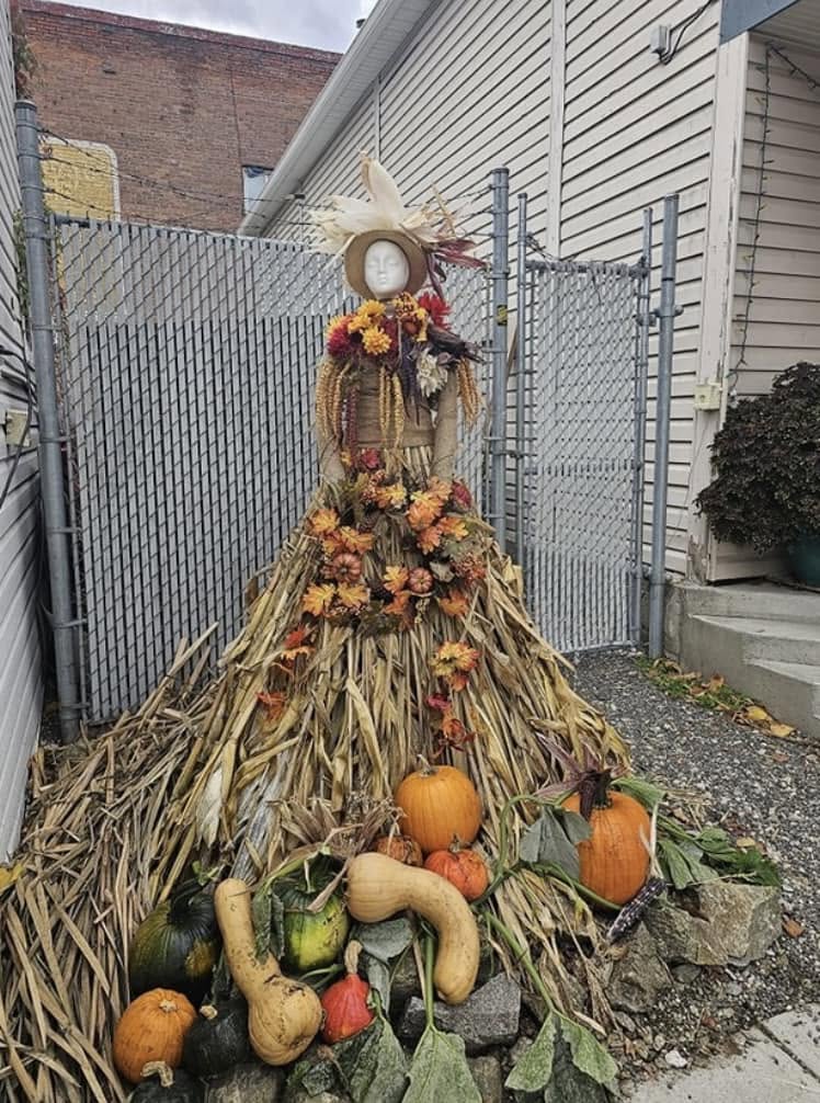 A scarecrow in a corn husk dress on display in downtown Armstrong in 2023